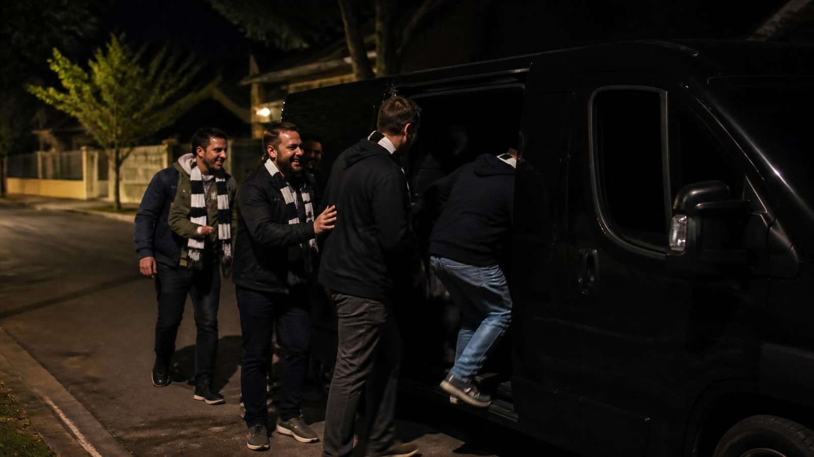 Friends getting a safe ride home after a Grand Final party