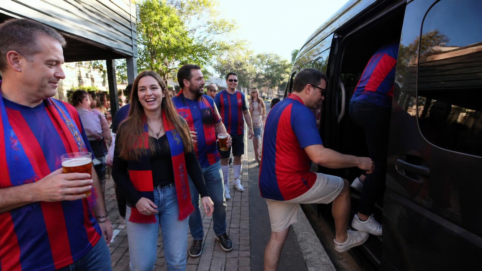 Newcastle Knights fans boarding a group minibus to the NRL Grand Final